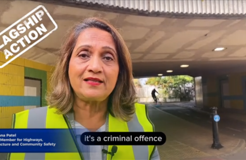 A still of Cllr Patel from the social media video. She is wearing a high viz jacket and standing near an underpass known for ASB issues.