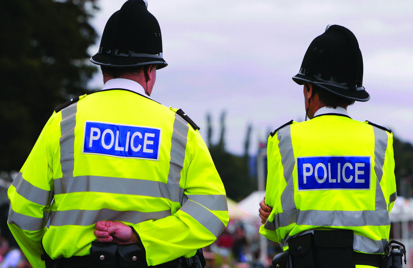 Police officers in high viz walking the beat