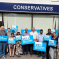 Bob Blackman MP with a team of activists out front the Harrow East Conservative Office holding up Vote Conservative signs